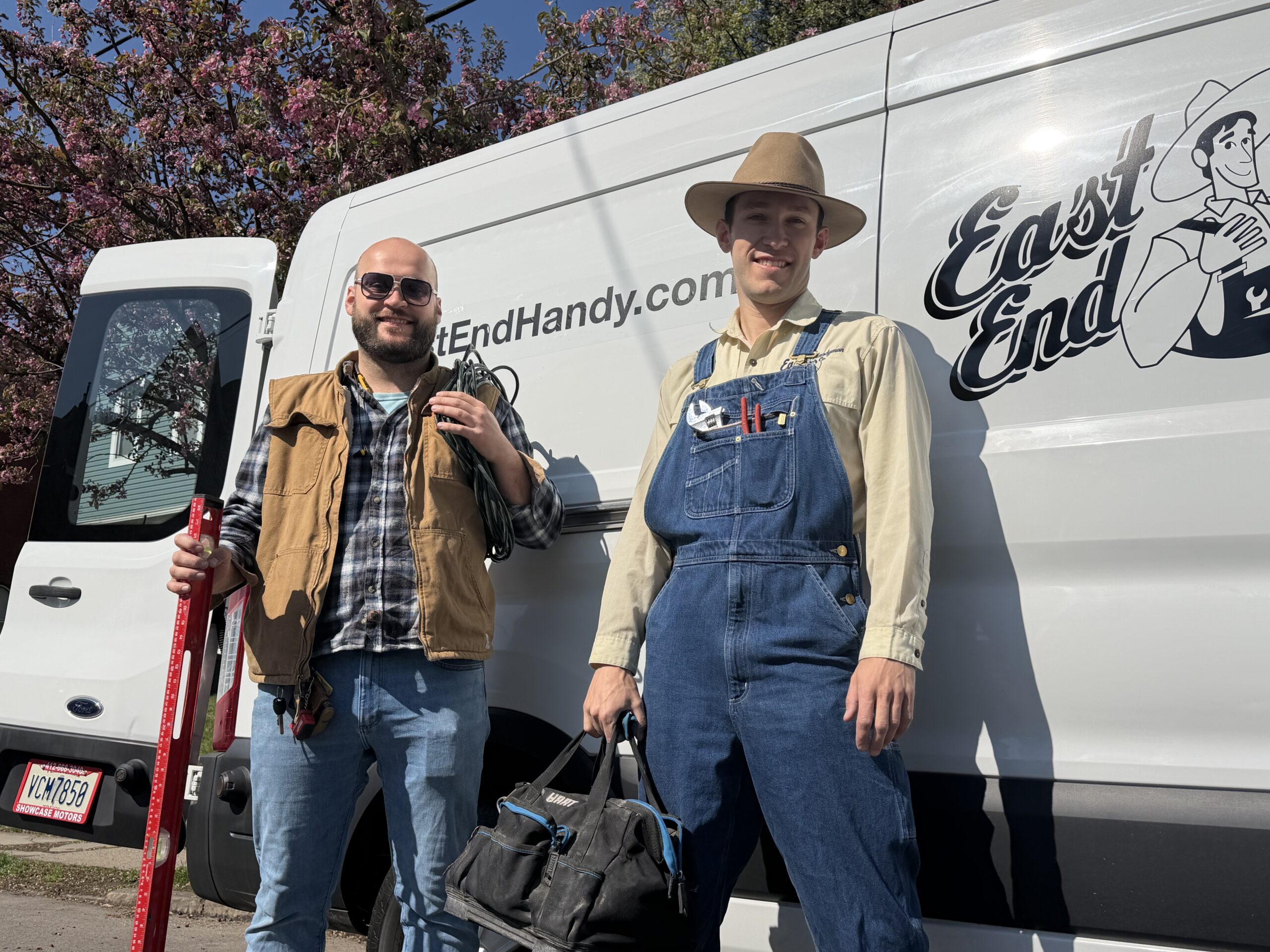 Dominik and Patrick in front of the handyman work van